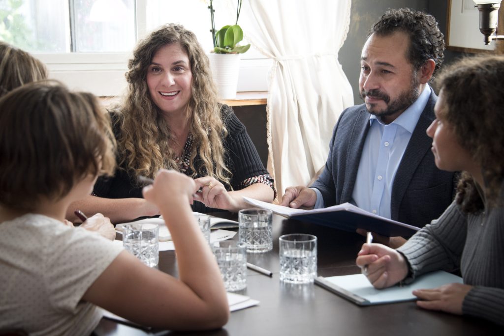 People sitting around a table talking