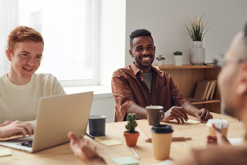 men at table smiling